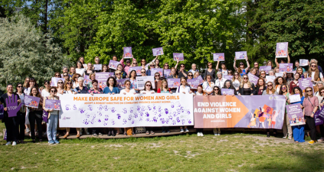 Group of women holding feminist signs